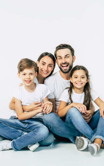 beautiful-happy-smiling-young-family-white-tshirts-are-hugging-have-fun-time-together-while-sitting-floor-looking-camera 2